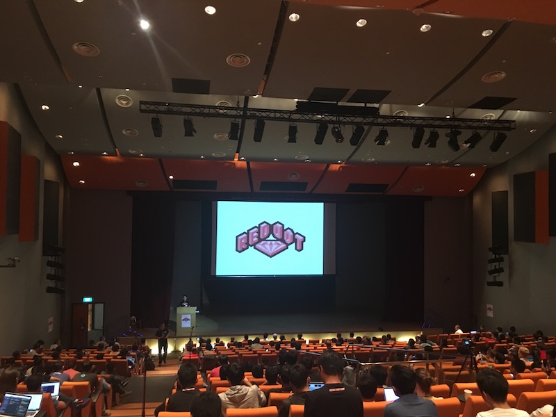 RedDotRubyConf 2016 logo on a slide shown on the conference stage