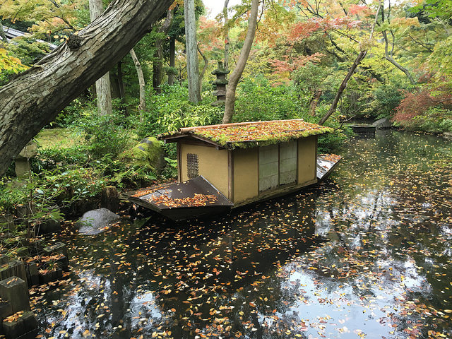 Boat in a pond in a garden at Nezu Museum in Tokyo