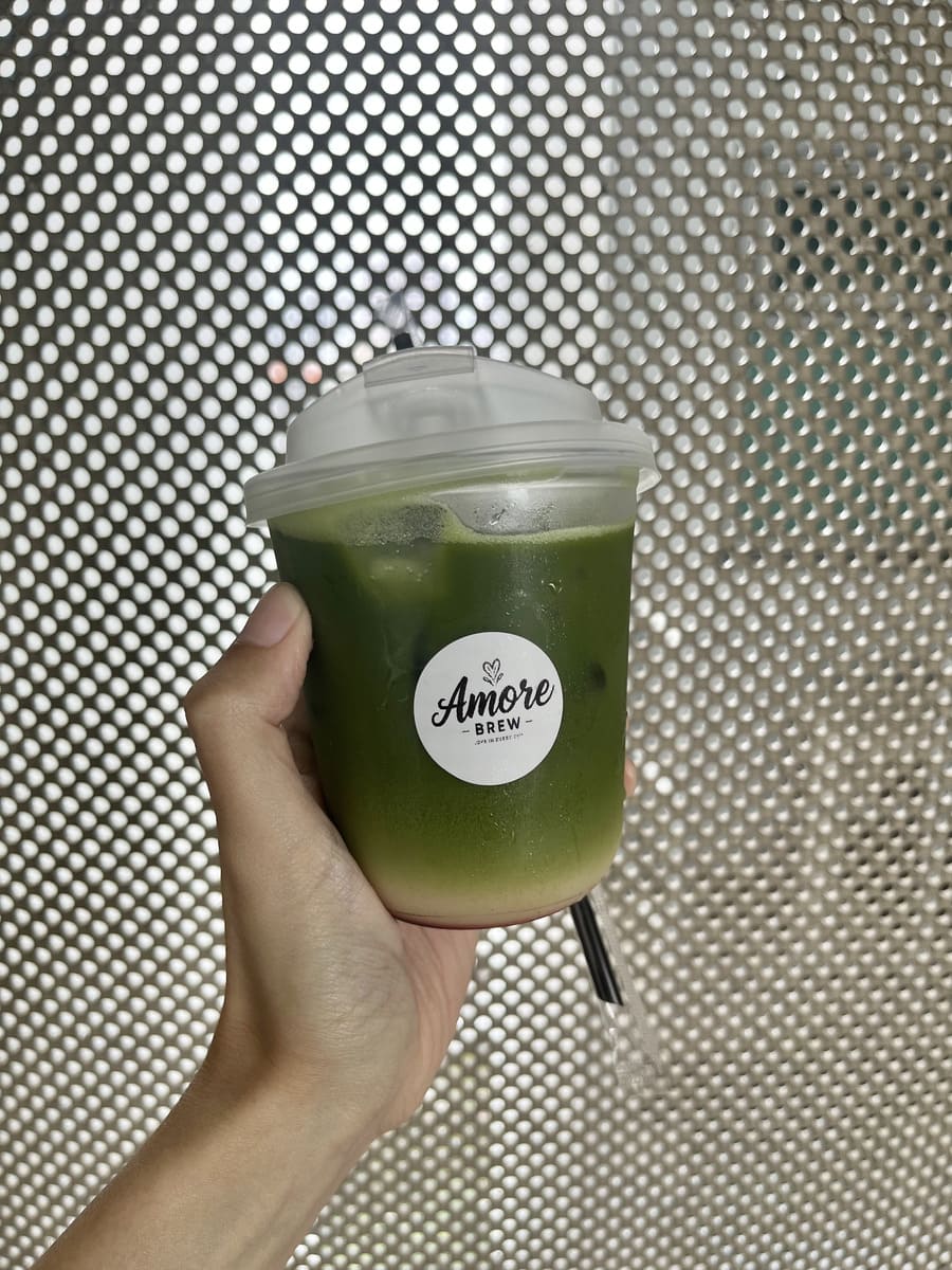 amoRe-brew matcha drink in hand