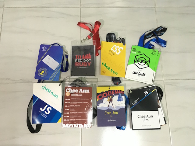 Conference badges and lanyards on the floor