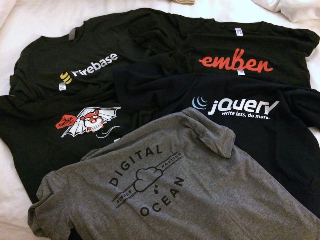 Conference t-shirts; showing logos of Firebase, Ember, jQuery and Digital Ocean, and mascot of Ember, Tomster