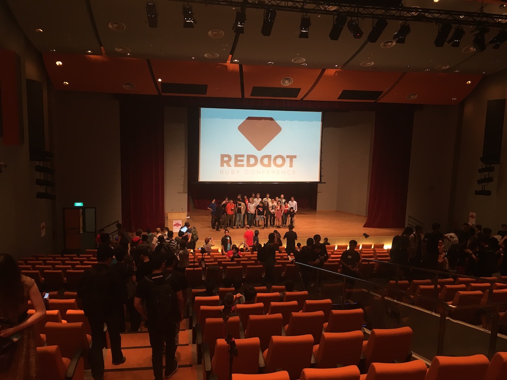 RedDotRubyConf conference hall, showing the original RedDotRubyConf logo